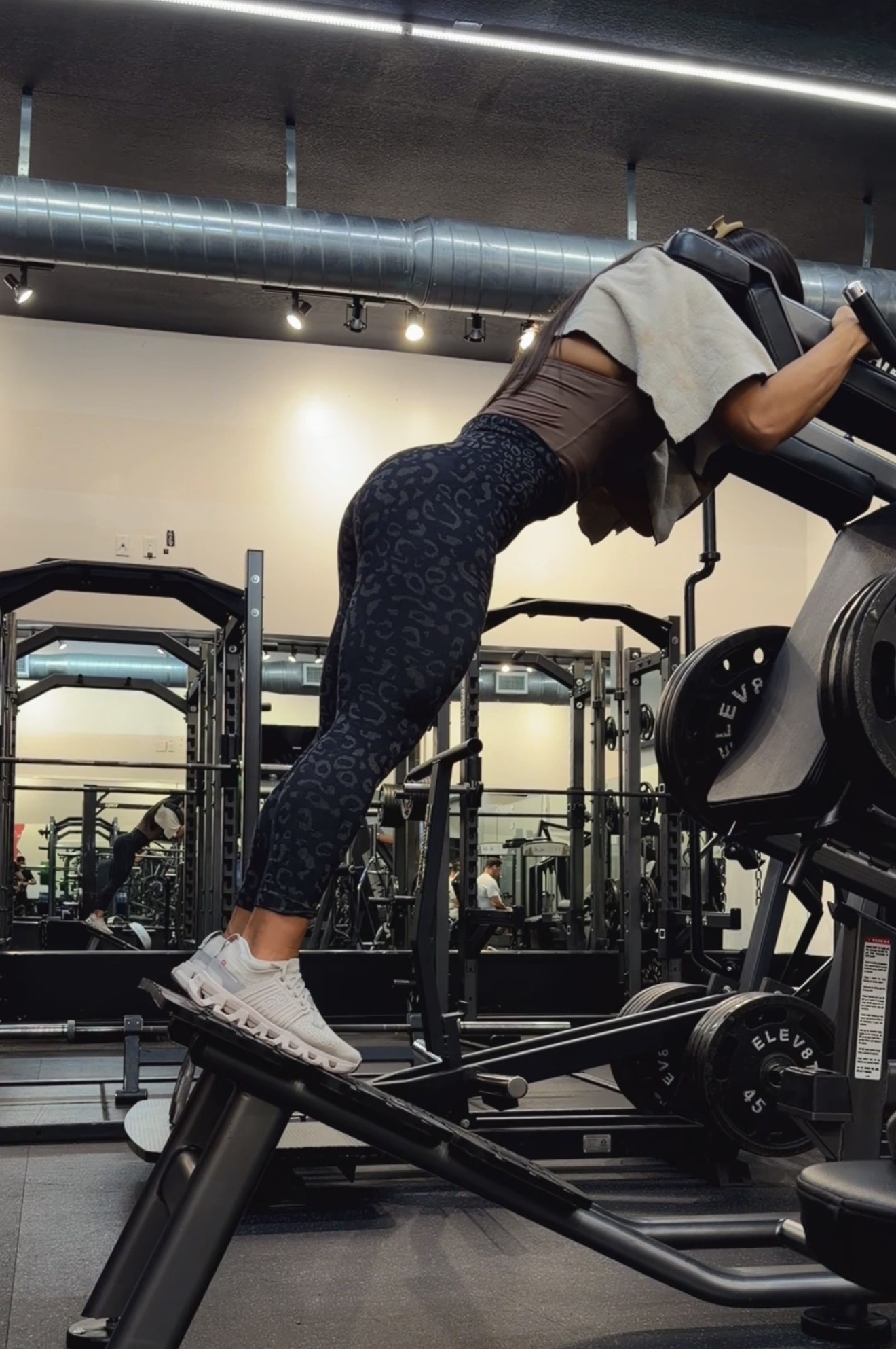 Laura strength training on a gym machine